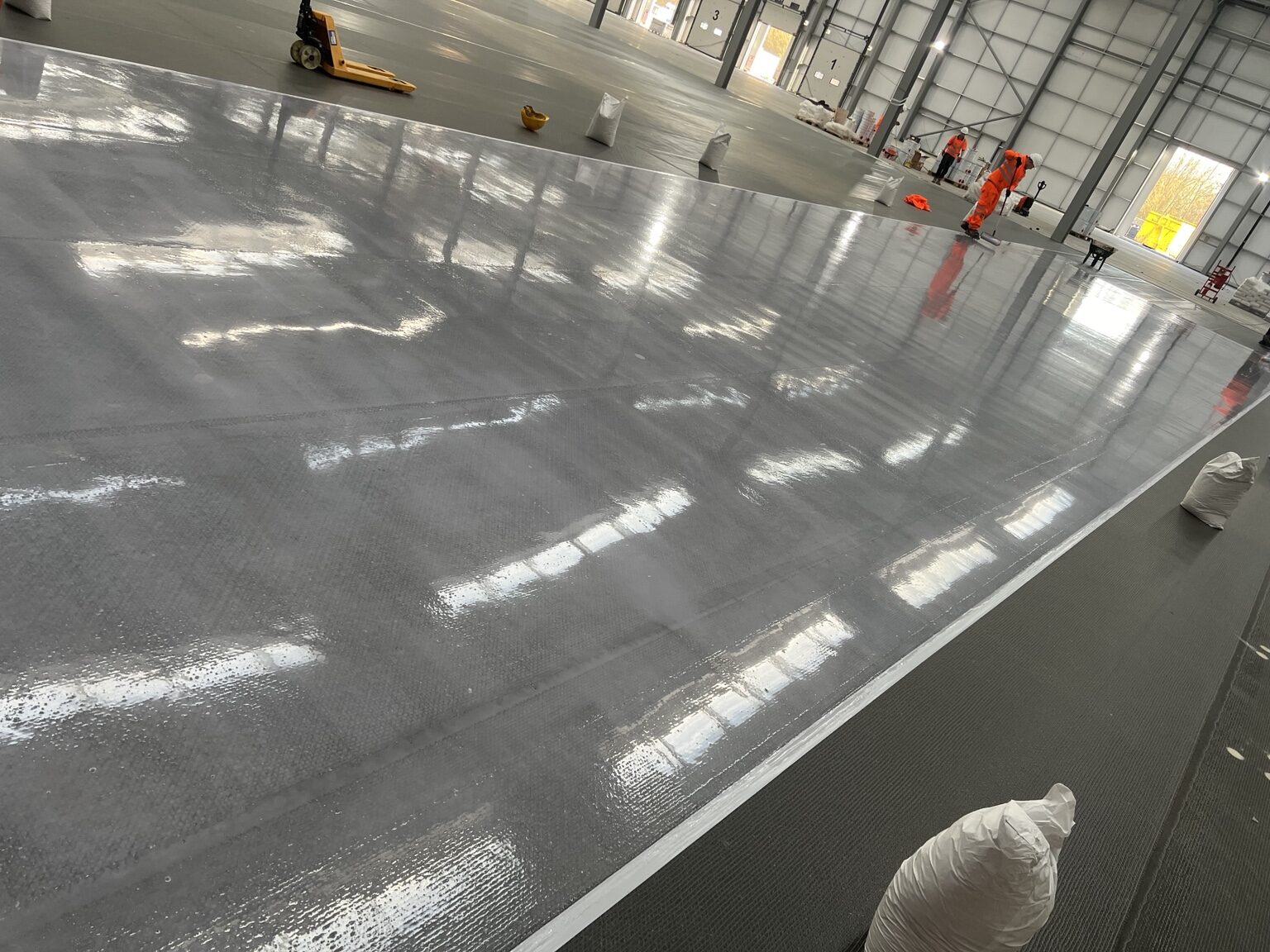 Large grey resin floor installed by TPR Flooring