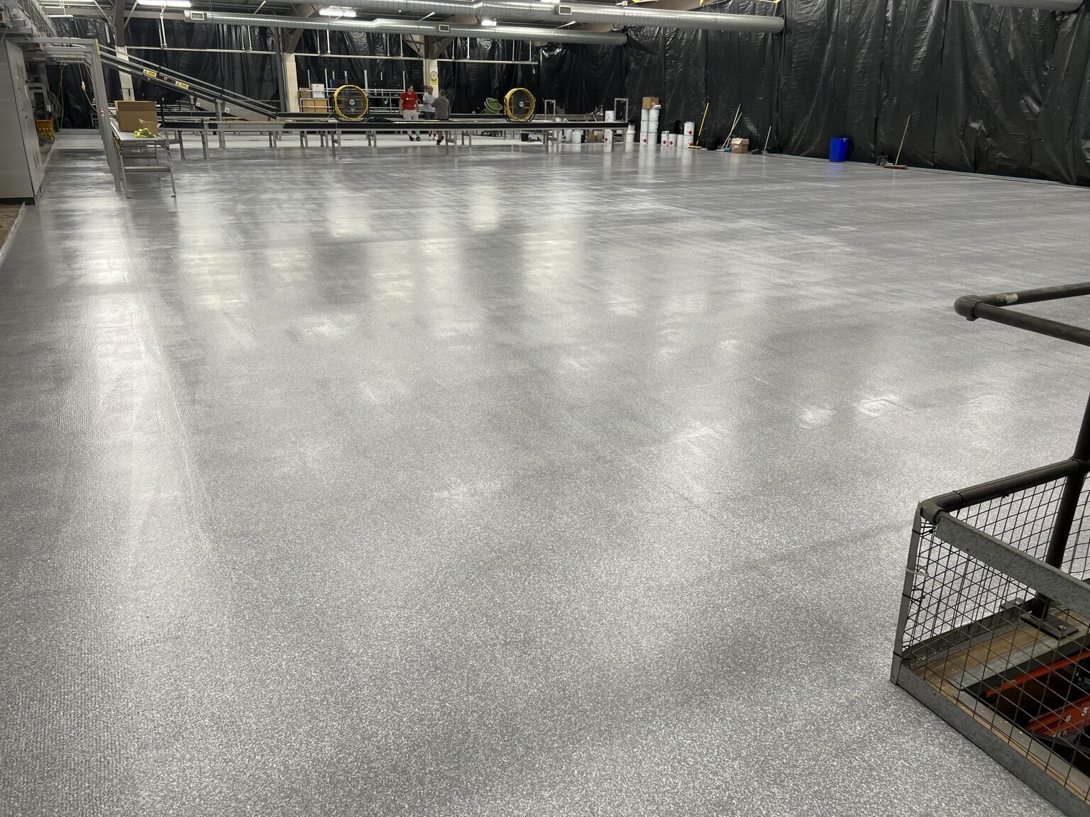 Large silver decorative resin floor in an industrial facility